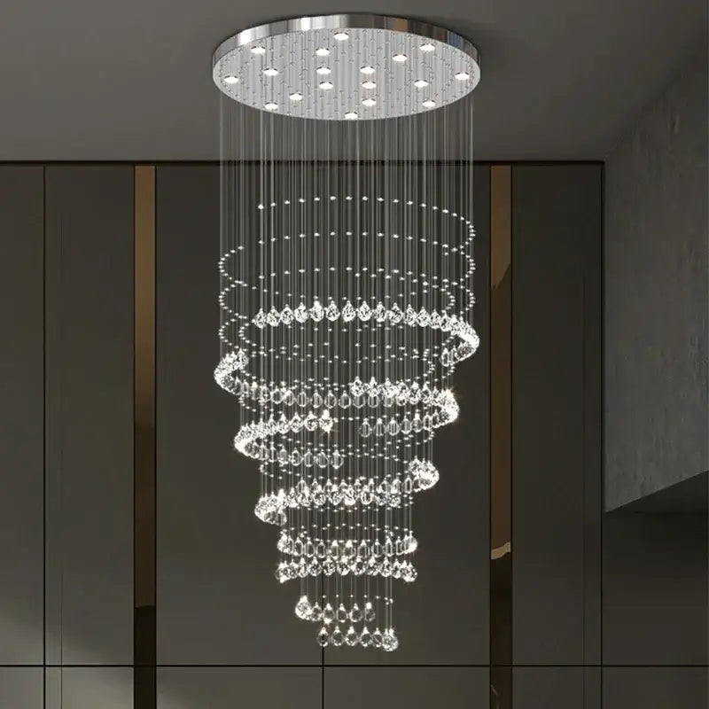 A modern decorbites crystal chandelier with clear faceted crystals and chrome mount for high ceilings living rooms