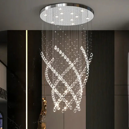 A decorbites crystal chandelier with a sleek chrome base and clear faceted crystals for high ceilings