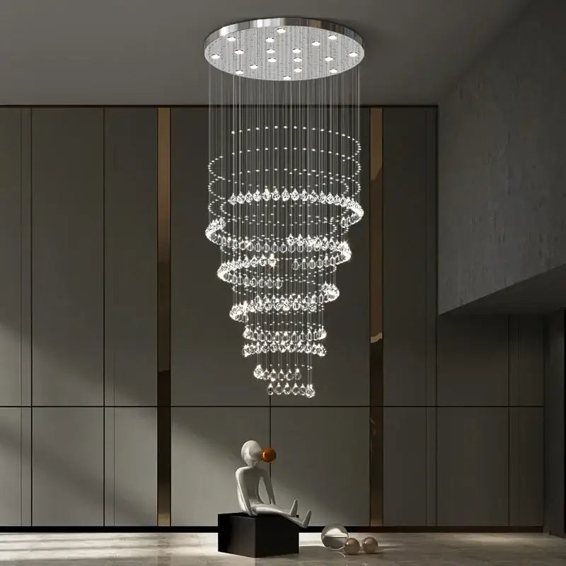 A modern chrome top decorbites crystal chandelier with cascading clear droplets for high ceilings living rooms