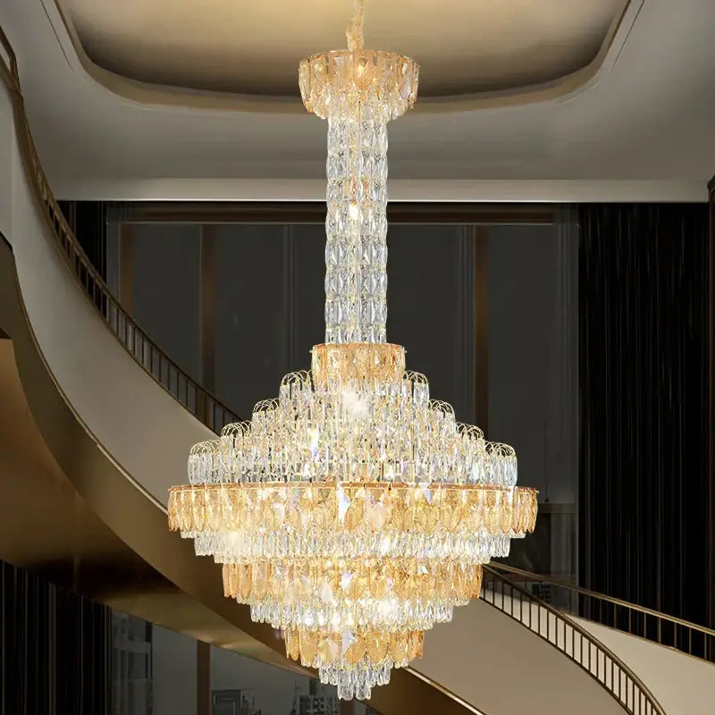 Decorbites crystal chandelier with cascading clear and amber glass prisms on gold frame for duplex living room