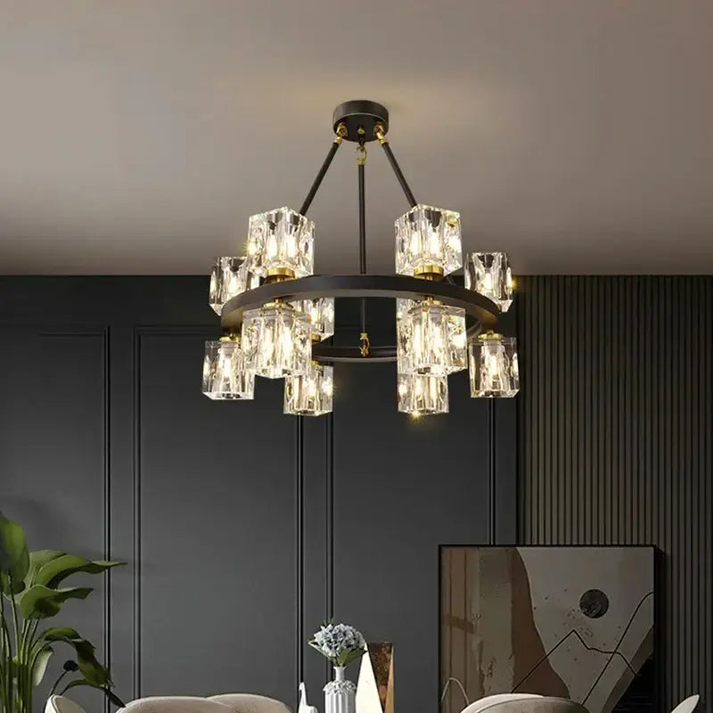 A modern decorbites crystal chandelier with black metal frame and clear glass cubes for dining room lighting
