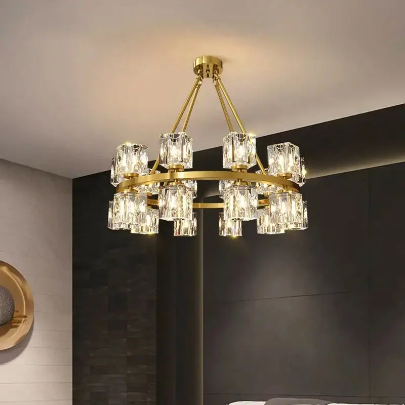 A decorbites crystal chandelier with a gold-toned metal frame and clear faceted glass shades for living room lighting