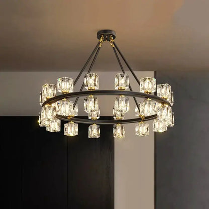 A modern two-tiered decorbites crystal chandelier with black metal frames and clear crystal cube pendants for living room lighting