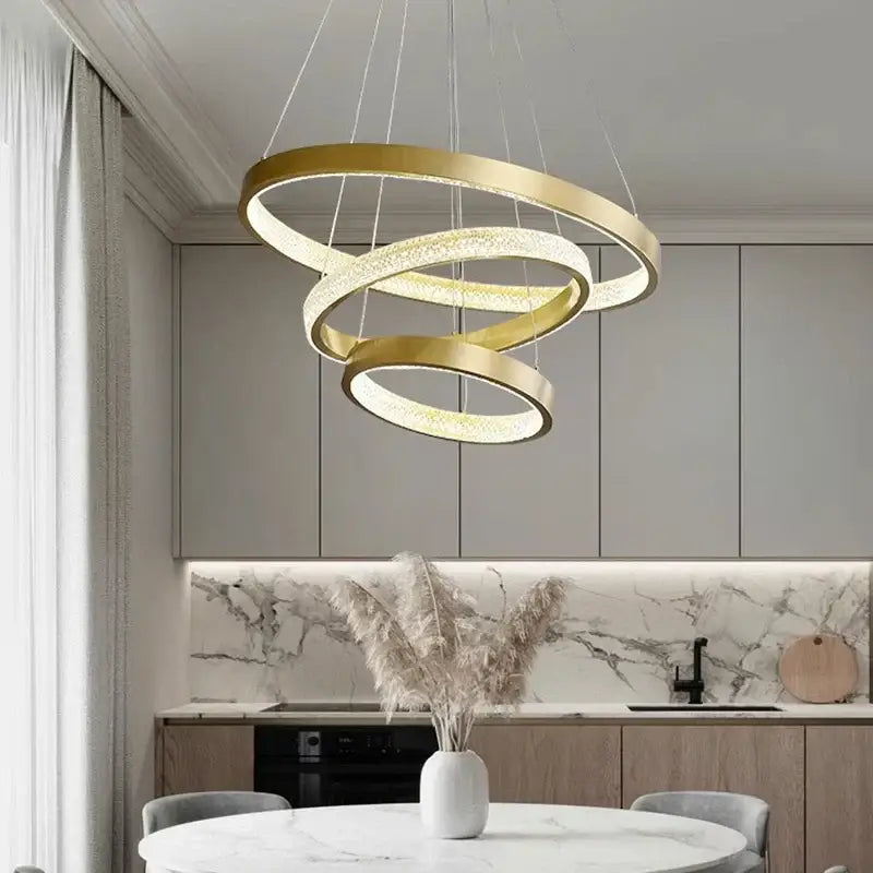 Gold-toned spiral decorbites crystal chandelier with embedded led lights for luxury living and dining room décor