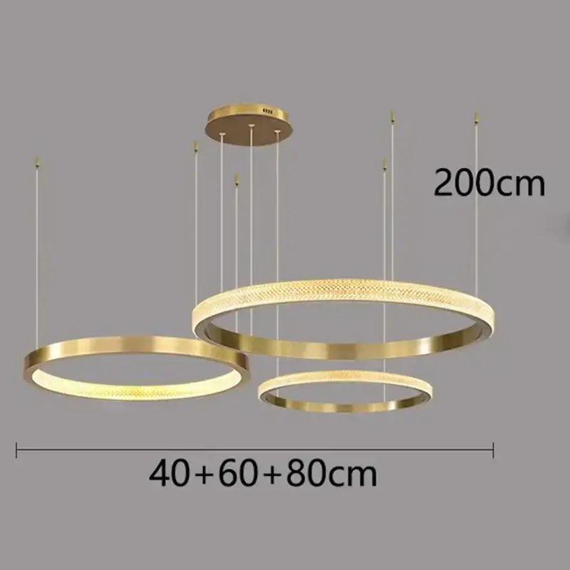 Modern gold-toned decorbites crystal chandelier pendant light with three concentric rings for living and dining room decor