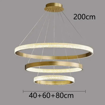 Gold-toned modern decorbites crystal chandelier with three concentric rings for living and dining room luxury décor
