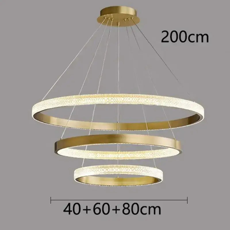 Gold-toned modern decorbites crystal chandelier with three concentric rings for living and dining room luxury décor