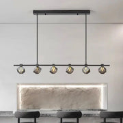 Modern black metal decorbites crystal chandelier with five faceted glass shades emitting warm glow for living and dining room