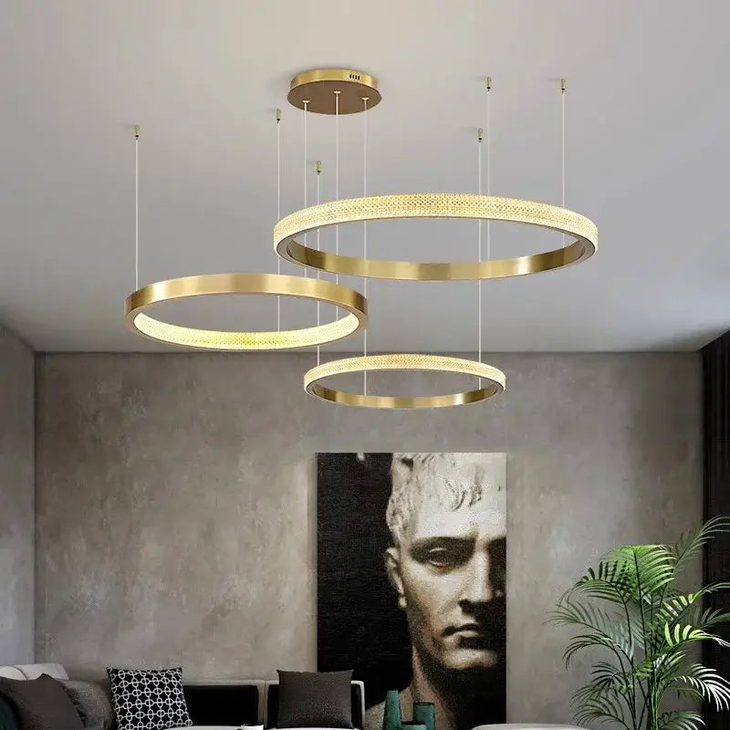 Modern gold-toned decorbites crystal chandelier pendant lights with intricate mesh detailing for living and dining rooms