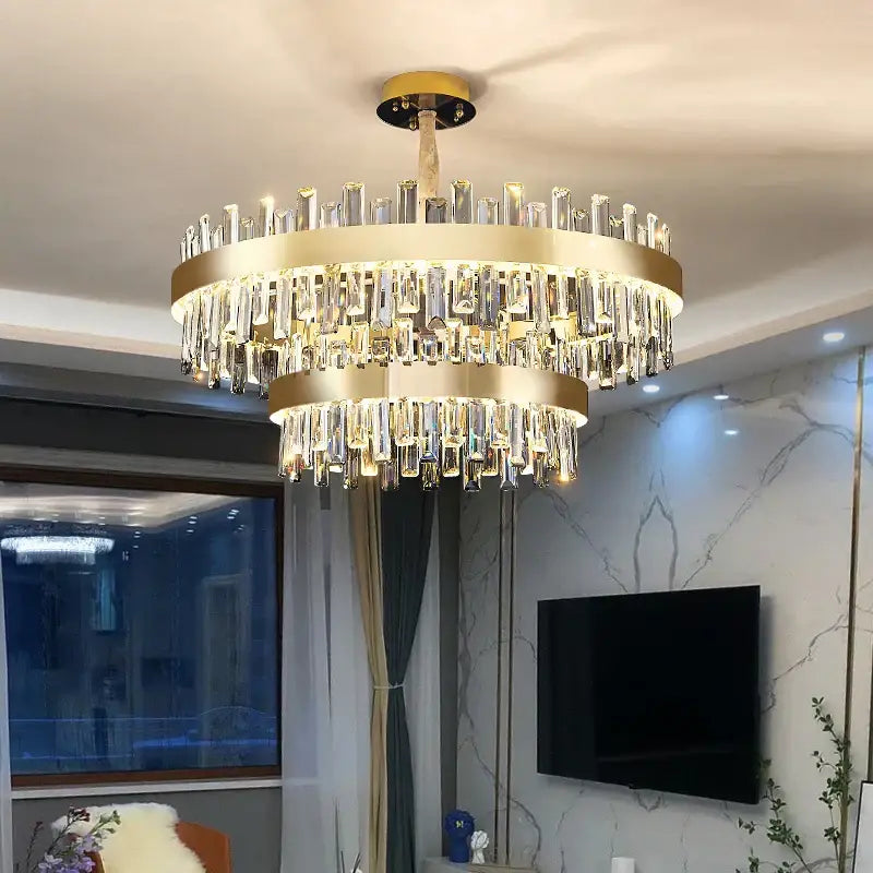 A modern decorbites crystal chandelier with gold metal frames and clear crystal prisms for living room and dining areas