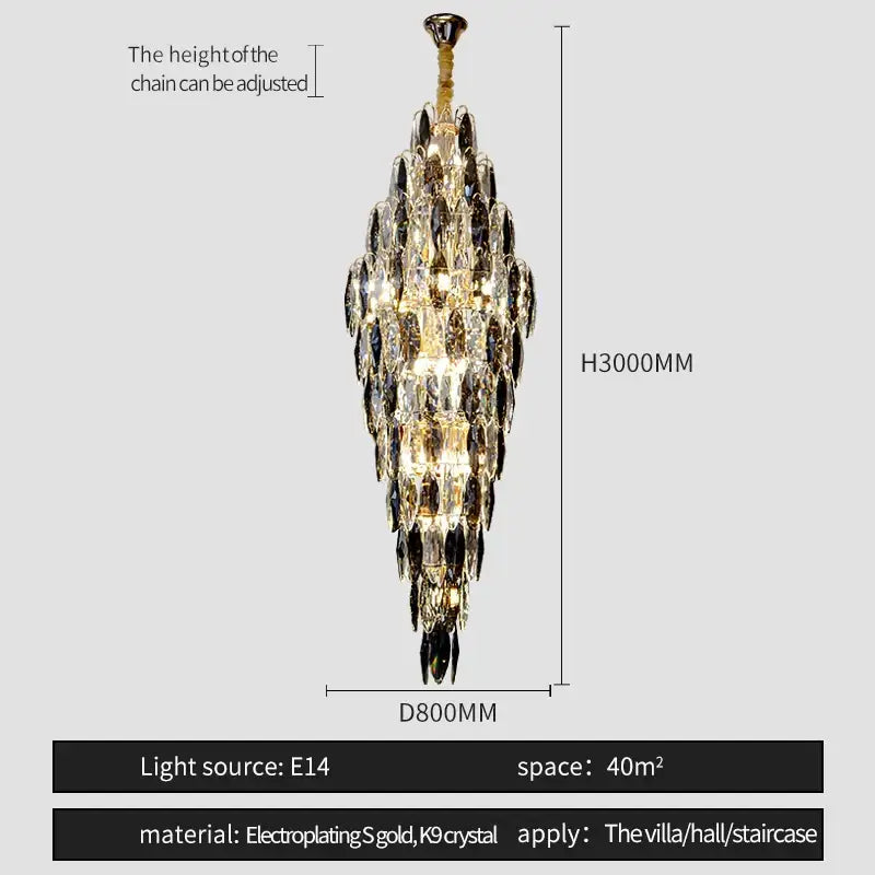 A tall decorbites crystal chandelier with cascading clear and dark crystal droplets on a gold electroplated chain for luxe decor