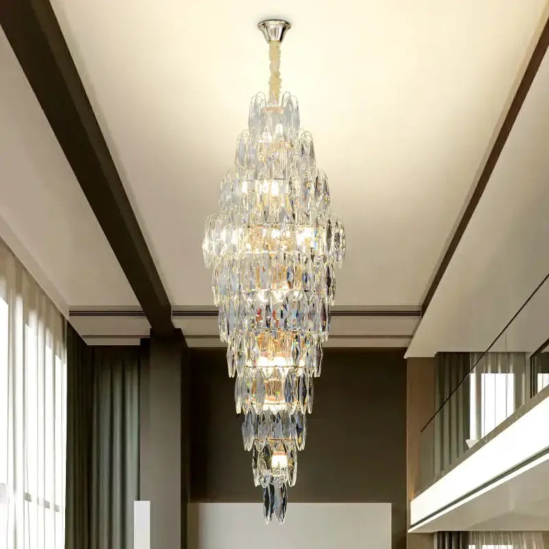 DecorBites crystal chandelier with multi-tiered faceted glass and polished chrome mount for luxe modern European villa decor