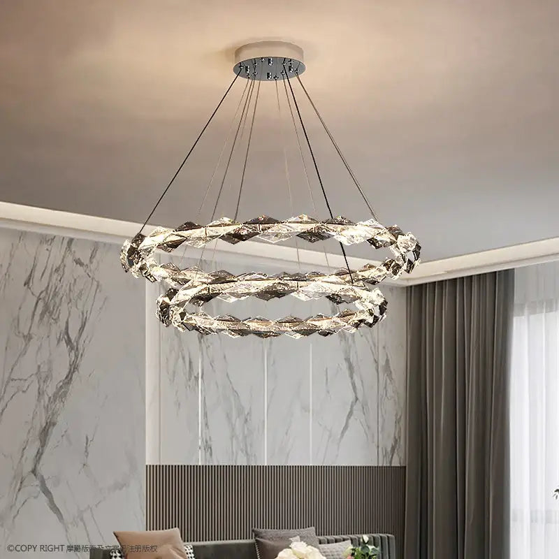 Modern decorbites crystal chandelier with double-ring design faceted crystals and sleek chrome finish for luxury spaces