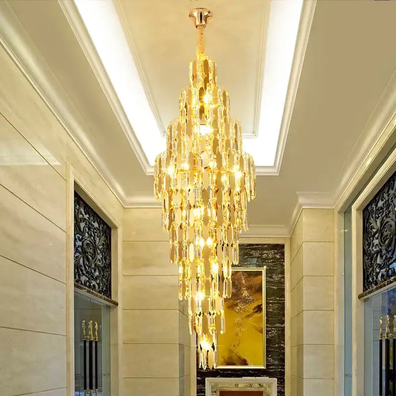 Decorbites crystal chandelier with golden polished brass finish and cascading crystal droplets for modern european living rooms