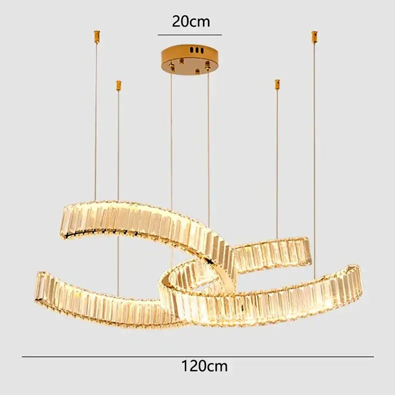 Gold-toned decorbites crystal chandelier with two interlocking curved rings and faceted crystal elements for modern lighting