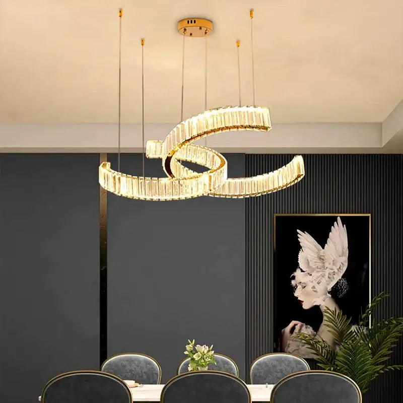 Gold-toned decorbites crystal chandelier featuring intertwined crystal-encrusted rings for modern home lighting