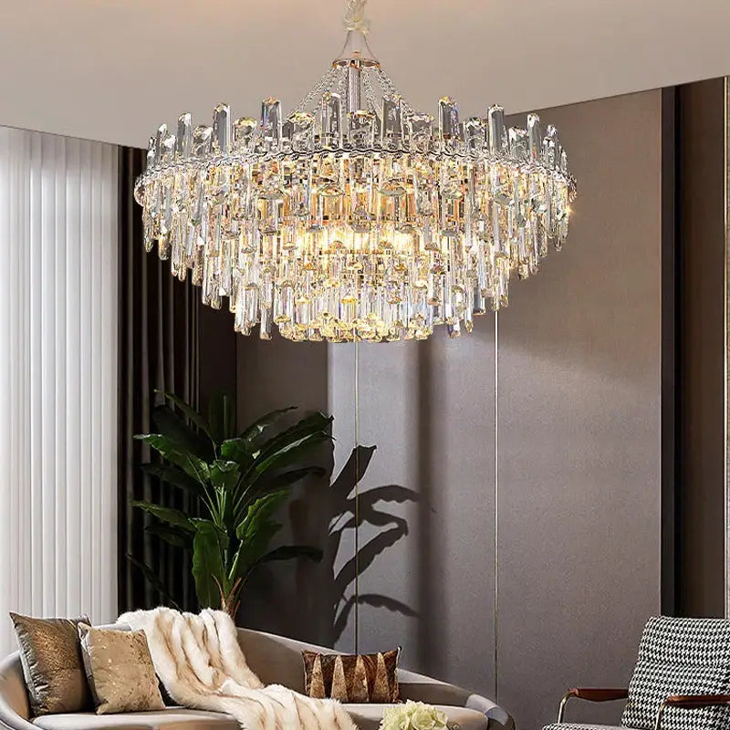 Decorbites crystal chandelier multi-tiered with clear and gold prisms on polished metal for modern luxe interiors