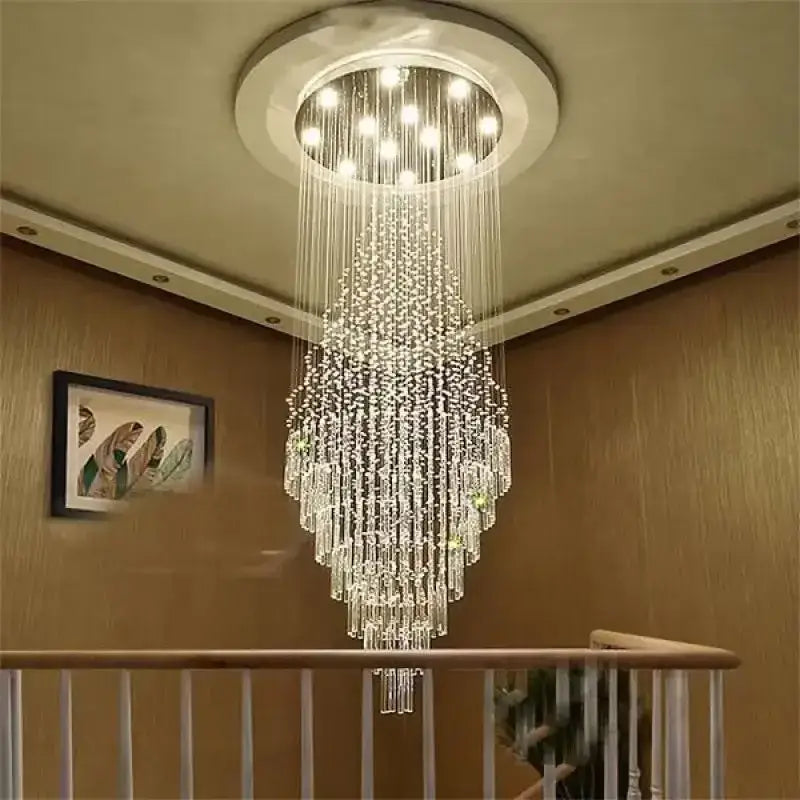A decorbites crystal chandelier with cascading clear glass beads and circular ceiling mount for staircase and living room lighting