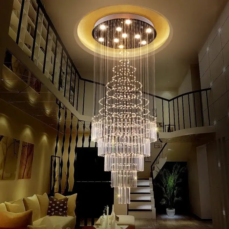 A modern multi-tiered decorbites crystal chandelier with cascading glass rods and embedded lights for staircase use