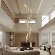 Modern decorbites crystal chandelier with cylindrical glass pendants and golden tops for circular stairwell lighting