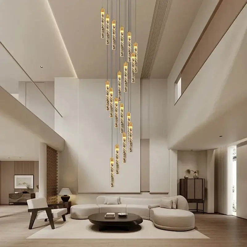 A modern decorbites crystal chandelier with vertical glass tubes and sparkling crystals for a two-storey foyer