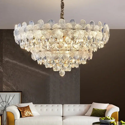A decorbites crystal chandelier featuring layered petal-shaped glass and teardrop crystals in french cream for luxury living spaces