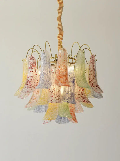A decorbites crystal chandelier featuring vibrant multi-colored translucent petal-shaped glass shades with speckled patterns