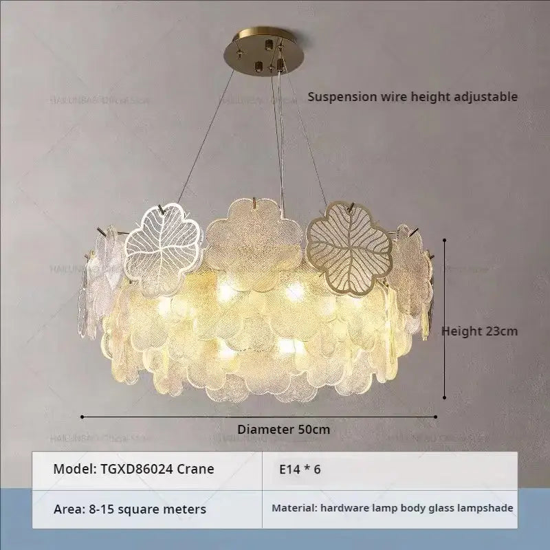 A modern circular decorbites crystal chandelier with layered translucent white and gold glass leaf lampshades