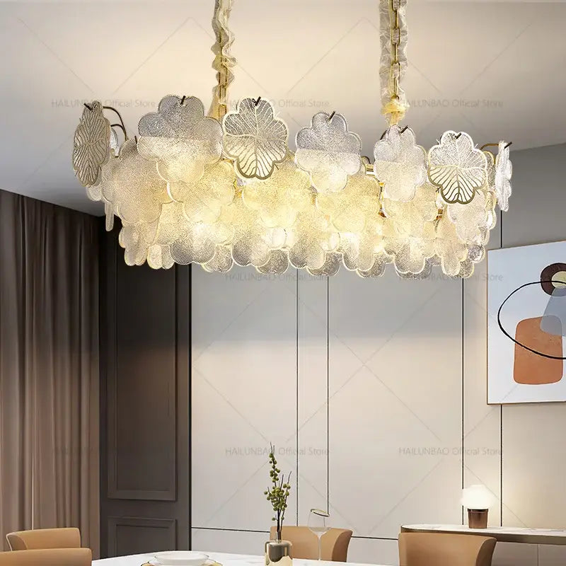 A decorbites crystal chandelier featuring delicate translucent glass with layered floral designs and a warm golden frame
