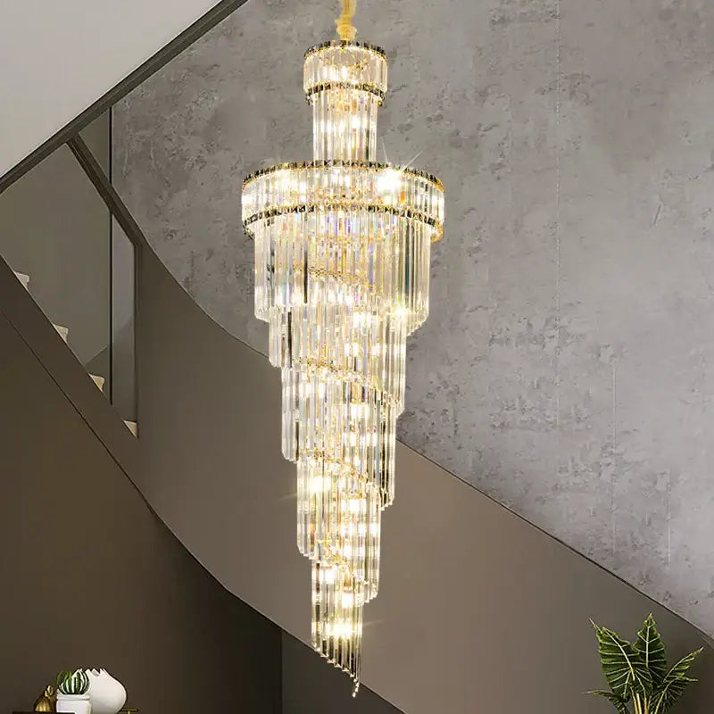 DecorBites crystal chandelier with cascading glass prisms and gold accents emitting warm glow for dining room and bedroom