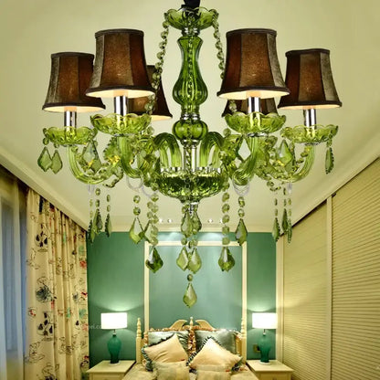 Emerald green decorbites crystal chandelier with dangling crystal droplets and dark brown lampshades for elegant spaces