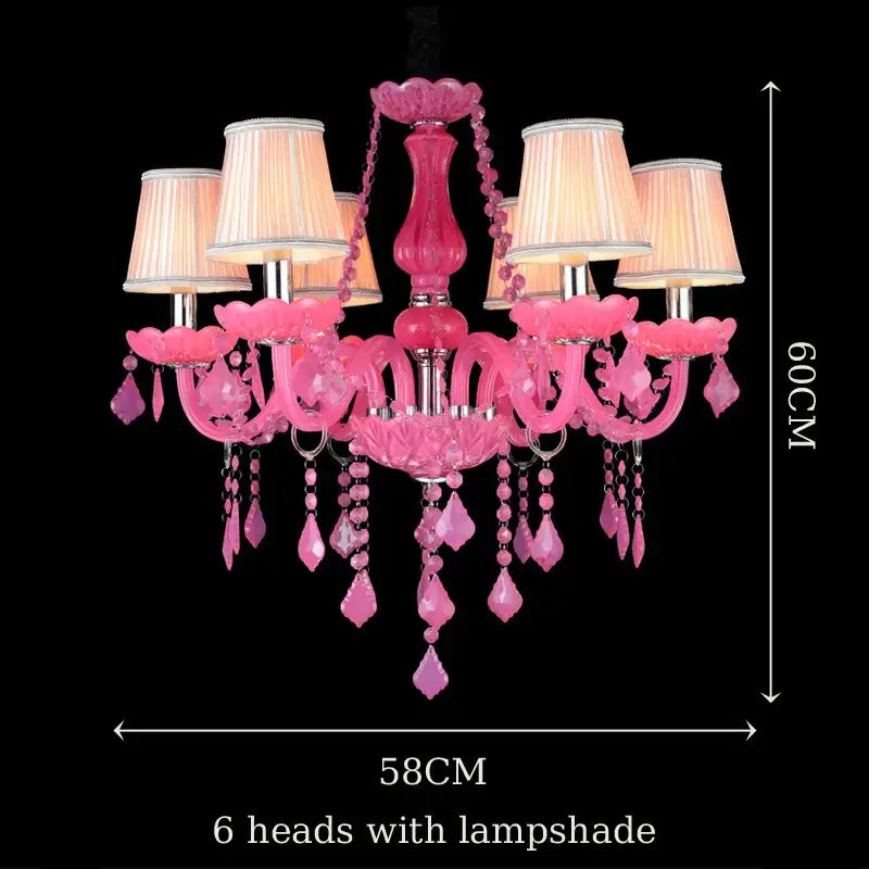 A vibrant pink DecorBites crystal chandelier with six lampshades and gemstone accents for elegant indoor lighting