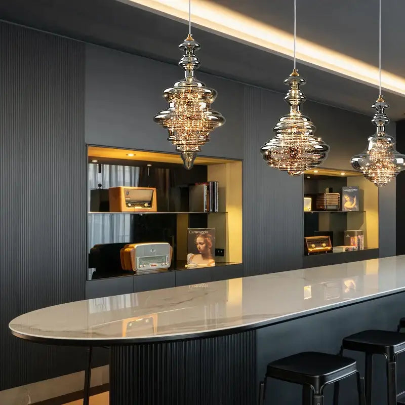 Three elegant tiered glass pendants with metallic finish in decorbites crystal chandelier for dining room lighting