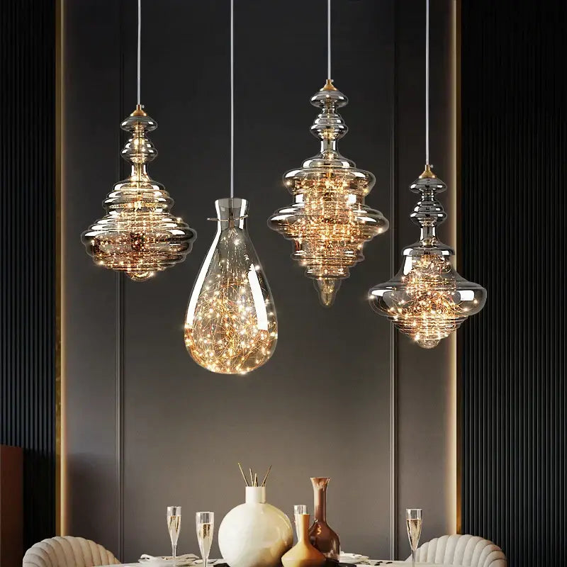 Four elegant decorbites crystal chandelier glass pendant lights with tiered design and warm golden filaments for dining room
