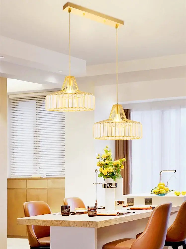 Gold-toned rectangular pendant light with woven translucent glass shades from DecorBites crystal chandelier for elegant decor