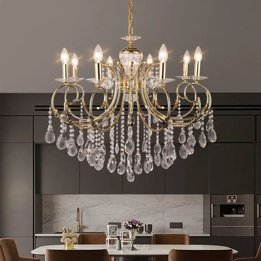 Gold-toned decorbites crystal chandelier with crystal droplets and candle-style bulbs for luxury nordic lighting