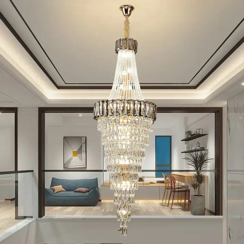 Multi-tiered decorbites crystal chandelier with gold-toned metal frame and glass prisms for luxury living spaces