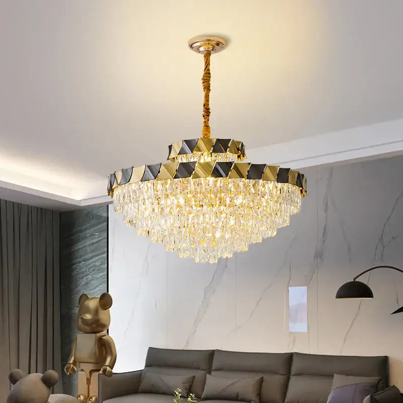 Gold-toned DecorBites crystal chandelier with tiered black and gold geometric panels and cascading crystal droplets for luxury lighting