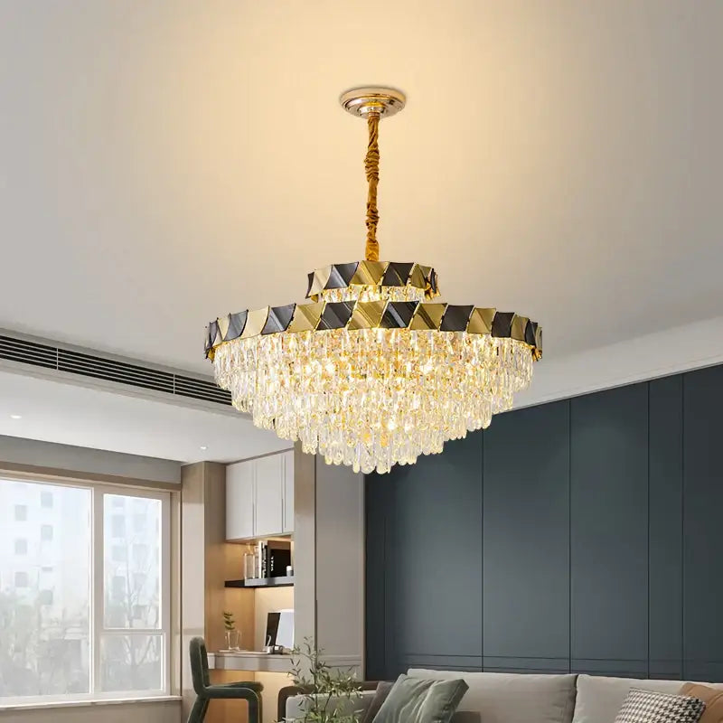 Decorbites crystal chandelier with gold-toned cascading crystal droplets and geometric black and gold upper ring for luxury lighting