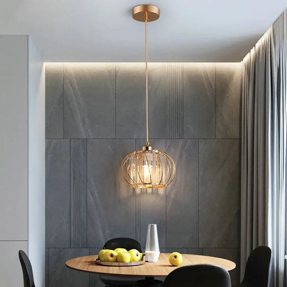 DecorBites™ modern gold-toned pendant light fixture with spherical cage design for dining room décor