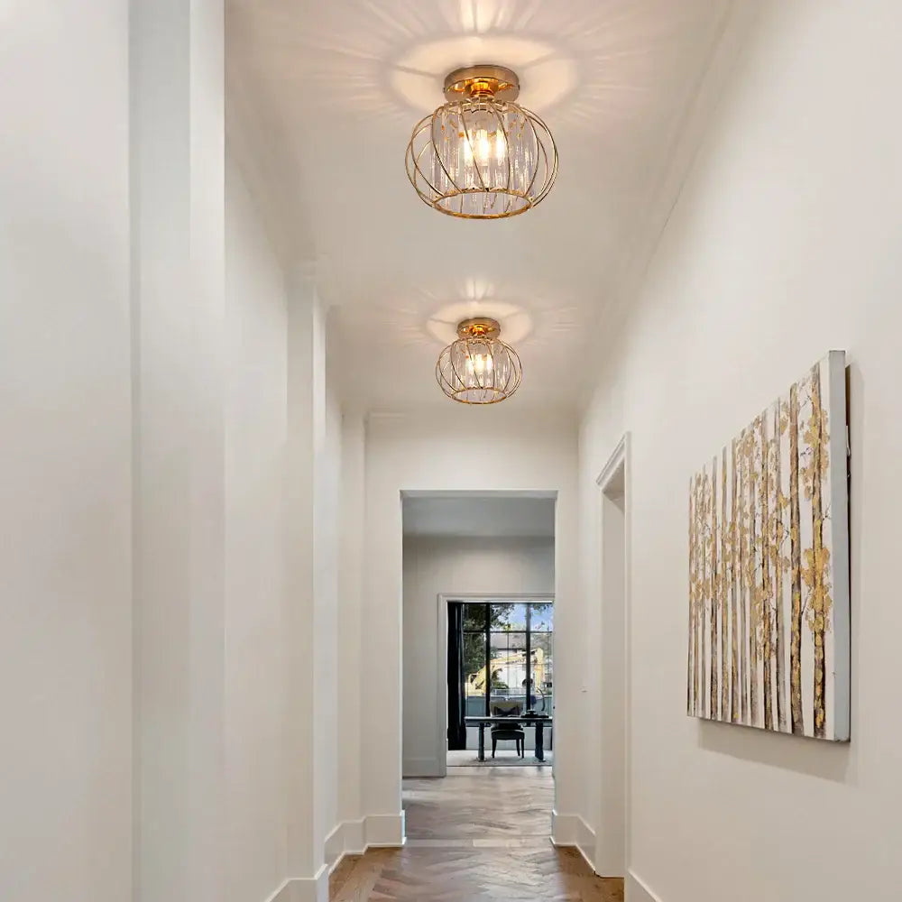 Decorbites™ gold-toned cage-style pendant light fixture with clear glass panels and exposed filament bulbs for modern décor