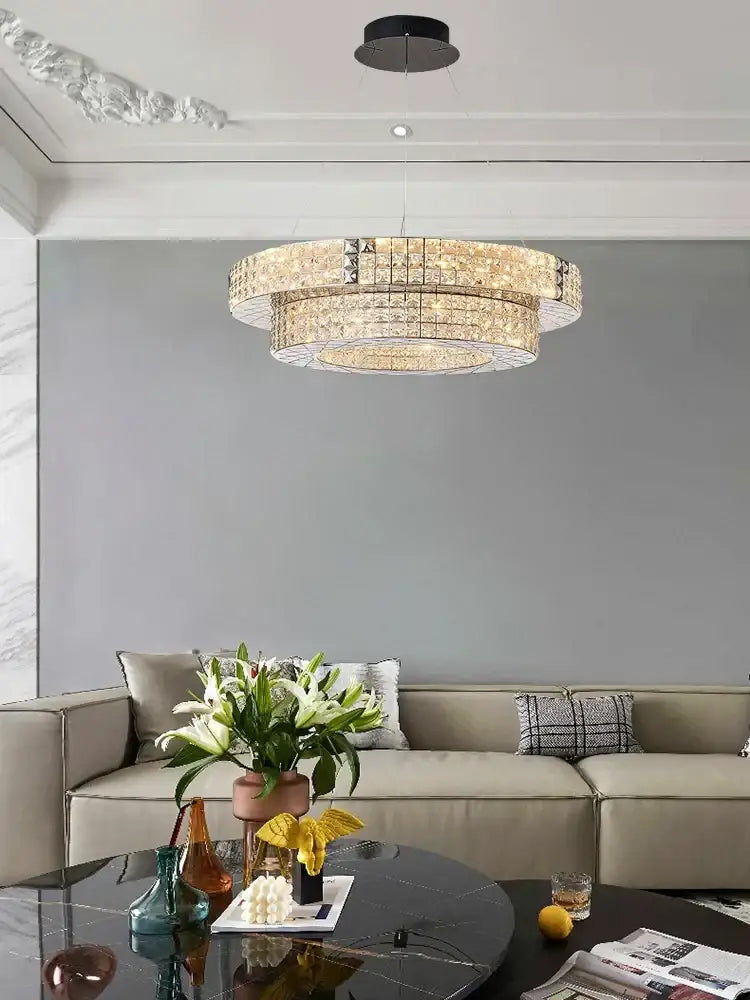 A decorbites crystal chandelier with double-tiered crystals and a sleek black mount for dining room lighting