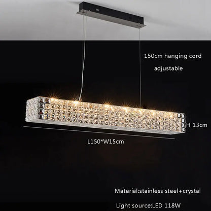 A sleek decorbites crystal chandelier with clear crystal facets and polished stainless steel frame for dining room lighting