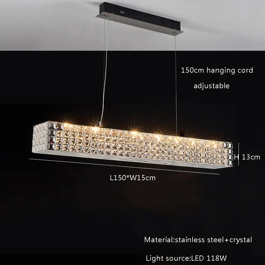 A sleek decorbites crystal chandelier with clear crystal facets and polished stainless steel frame for dining room lighting