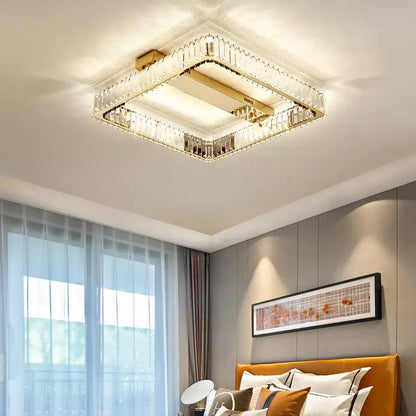 Square decorbites crystal chandelier led ceiling light with gold-finished frame and illuminated center for bedroom lighting