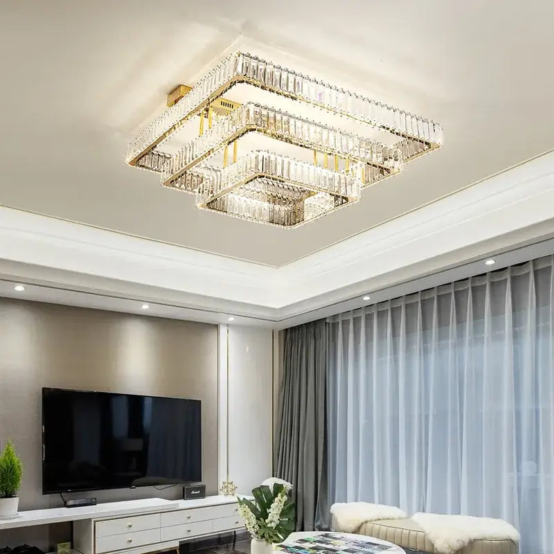 A modern DecorBites crystal chandelier ceiling light with layered crystal tiers and gold LED frame for luxury foyer lighting