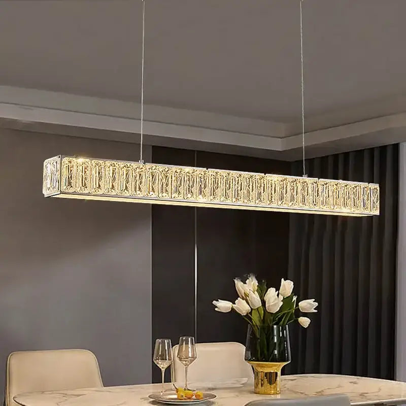 A modern luxury decorbites crystal chandelier led with elongated golden design and crystal elements for warm home lighting