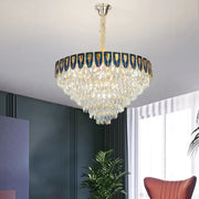 Luxurious decorbites crystal chandelier with tiered clear crystals and ornate blue gold border for modern living room