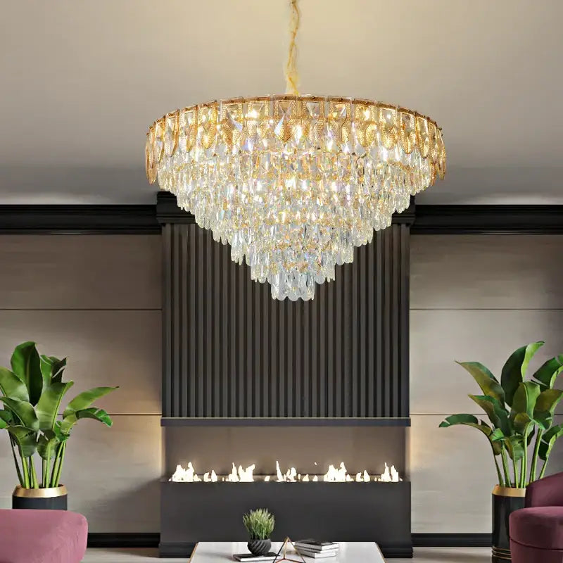 Decorbites crystal chandelier with gold-toned metal accents and cascading clear crystals for luxury living rooms and hotels