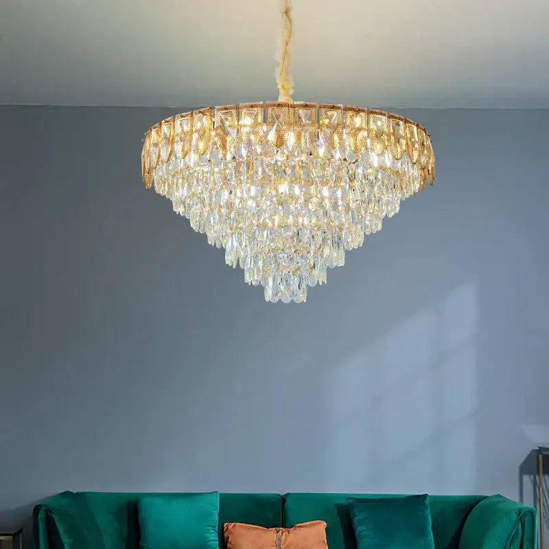 A decorbites crystal chandelier with gold-toned metal frame and cascading clear crystals for luxury living rooms